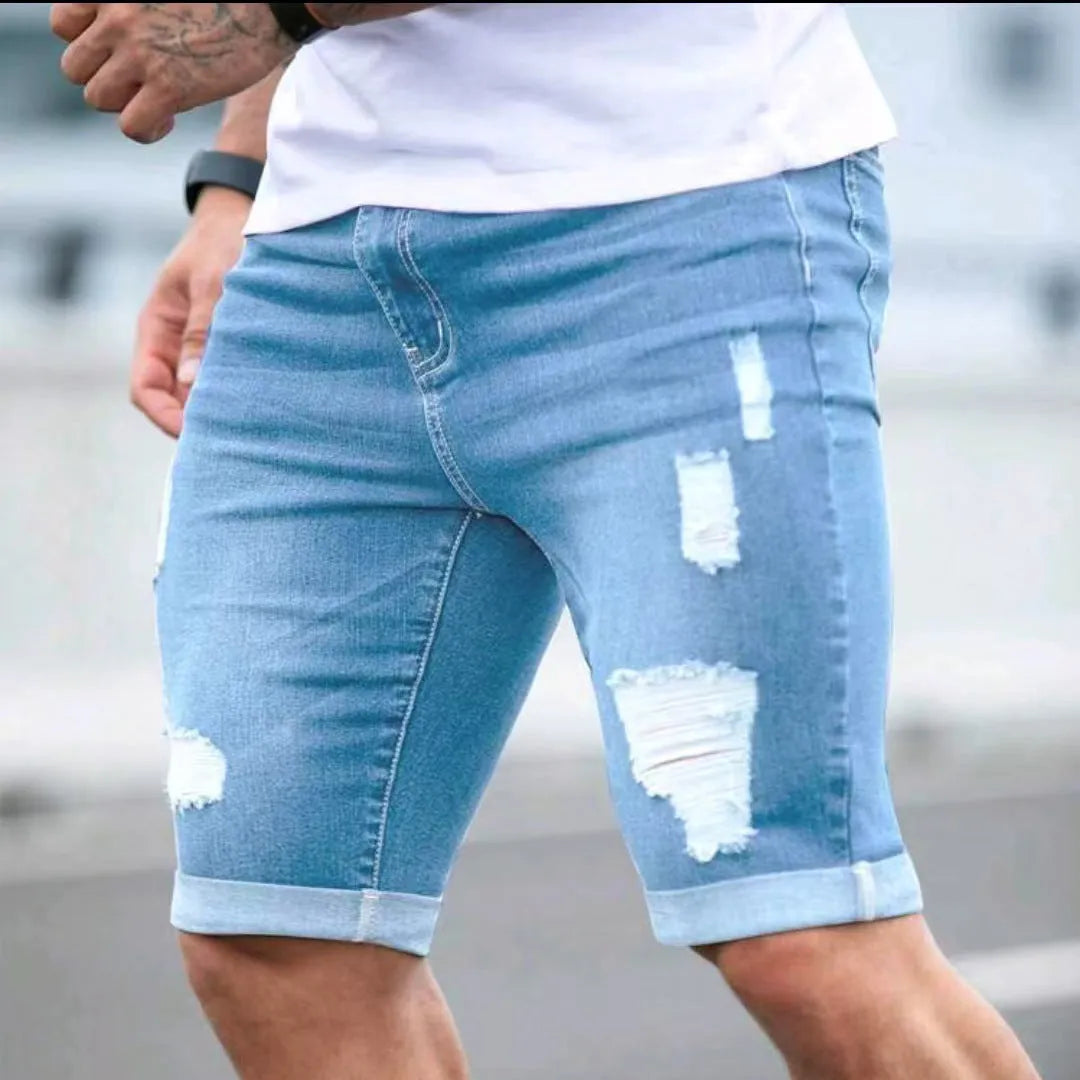 Sky blue men's denim shorts with a multi-hole distressed design on the front, showing a low waist and straight leg cut.