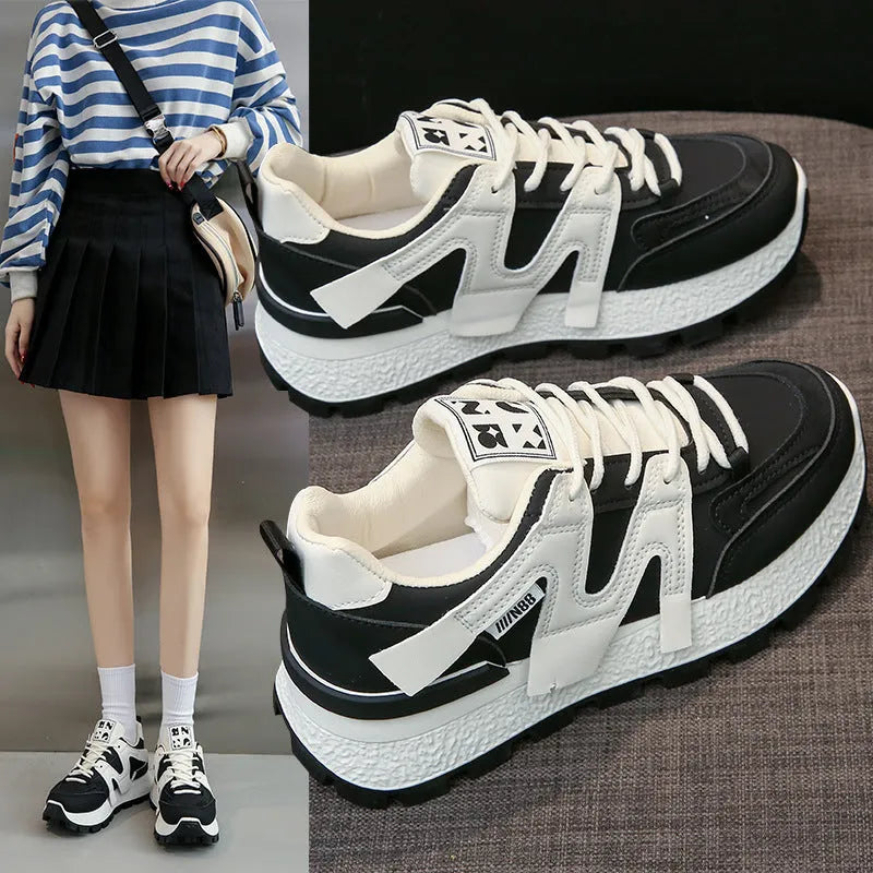 Low-top casual sneaker with artificial PU upper and rubber sole in black or white colour