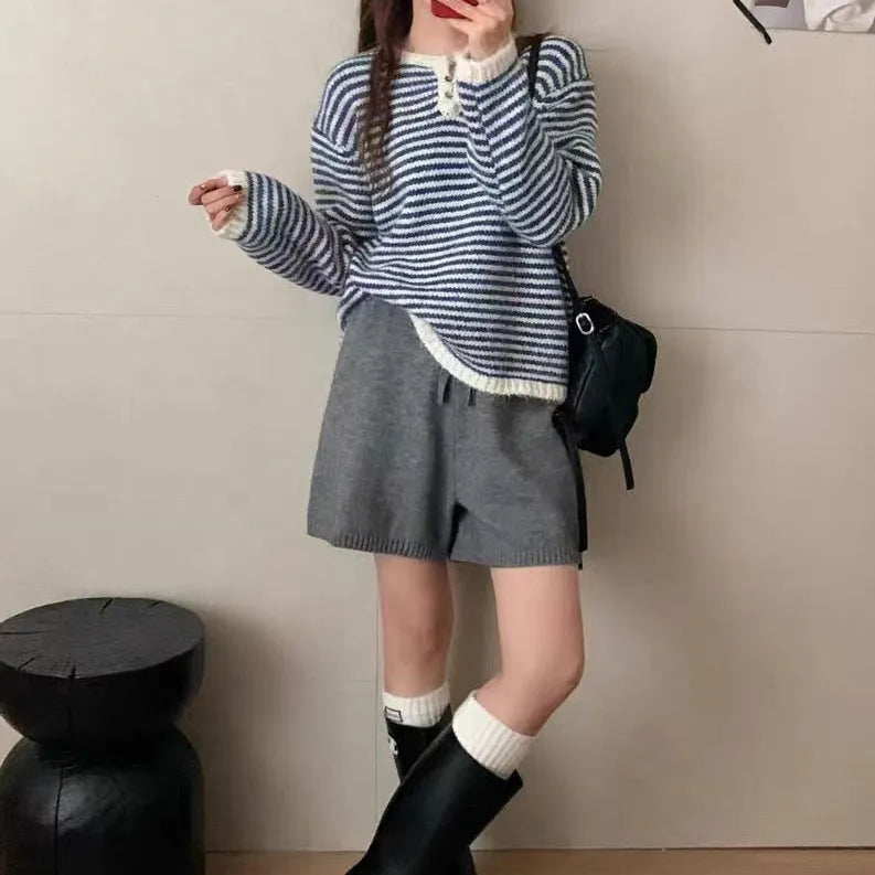 Red and blue striped cashmere pullover sweater for women with plaid pattern and loose fit.