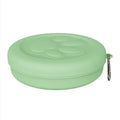 Portable plastic dog bowl set with snack box in light green two-tone design.