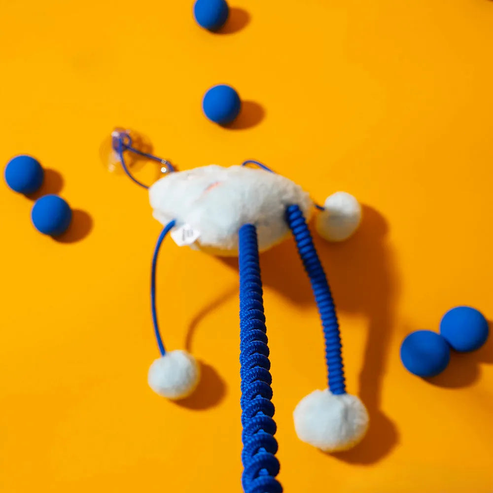 Blue four-ring soft plush cat toy with elastic rope and a mint bell.