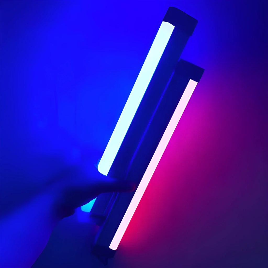 A rechargeable LED light tube stick showing blue or purple glow, used as a fill light for photography or dormitory decor.