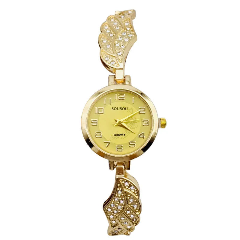 Women's stainless steel watch with round dial on wrist, showing gold face colour option and vachette clasp.