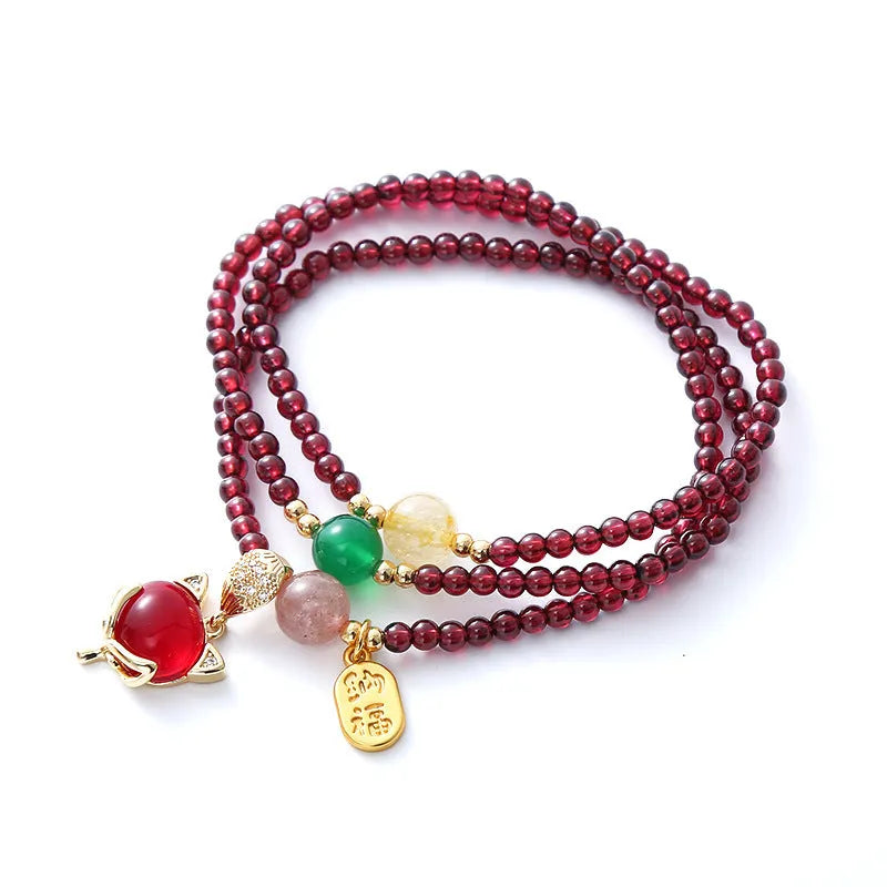Purplish red garnet crystal fox charm bracelet with adjustable rope design