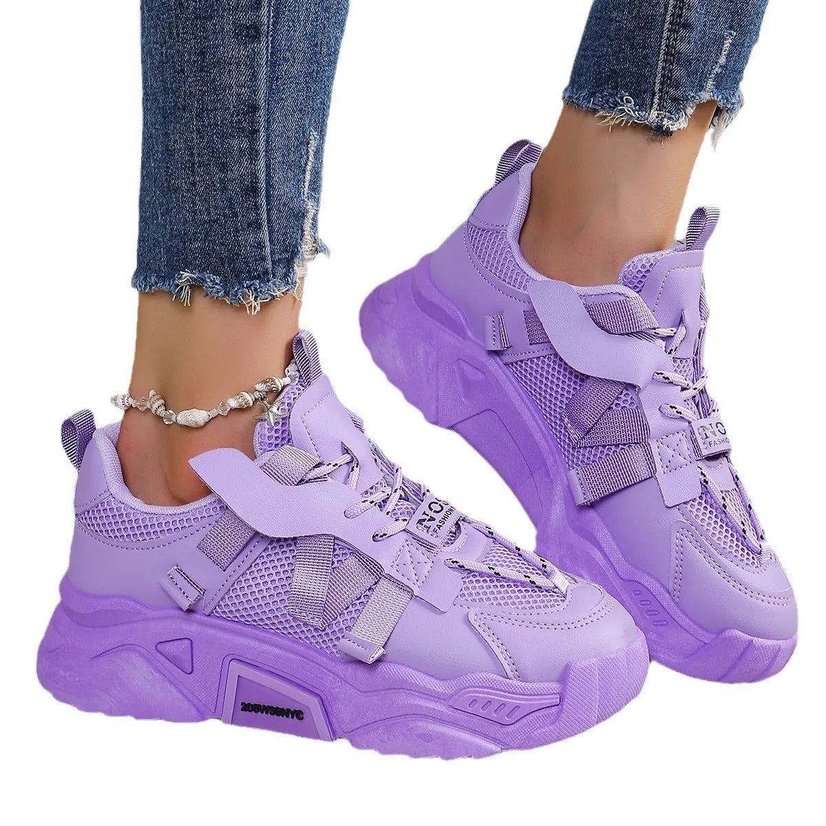 Women's purple platform mesh sneakers with lace-up front on wooden floor