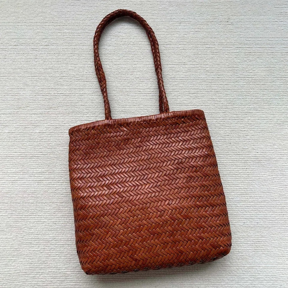 Brown handmade woven tote bag with three-dimensional pocket made from cowhide leather