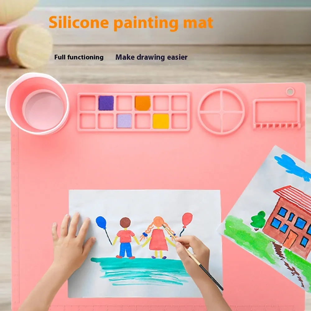 Light blue silicone painting mat with two attached bowls for watercolour supplies.