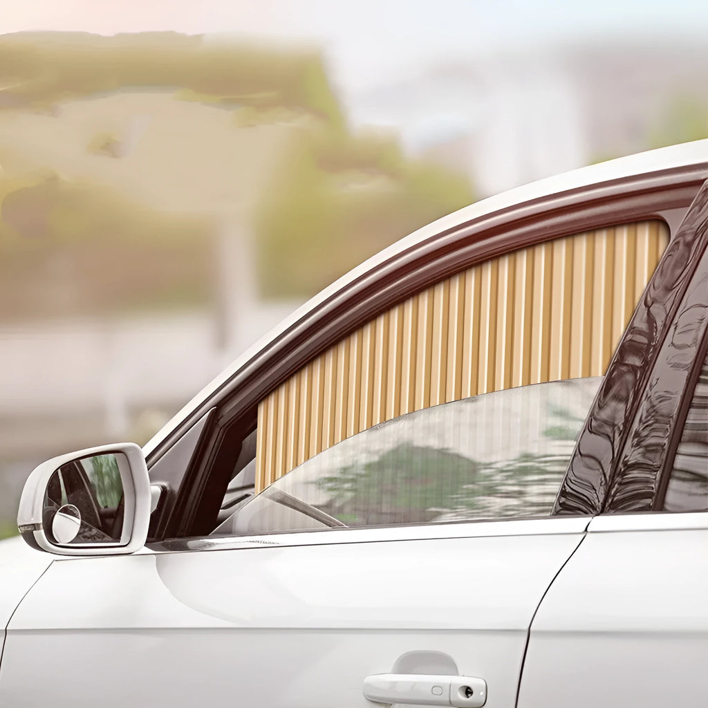 Auto retractable car sunshade curtain in opaque cloth, shown in a silver colour on a car window.
