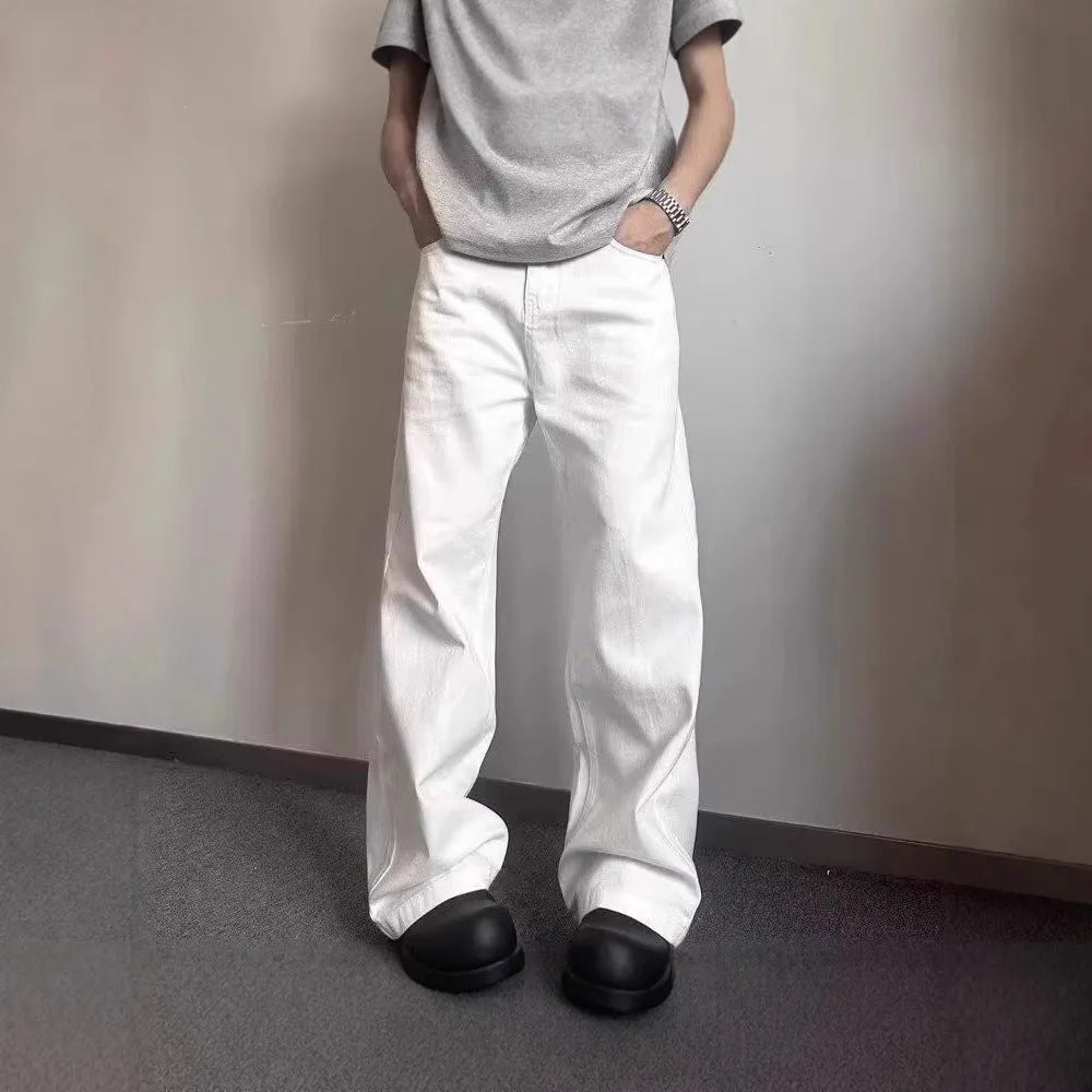 Men's white denim jeans with loose straight wide leg cut and mid waist