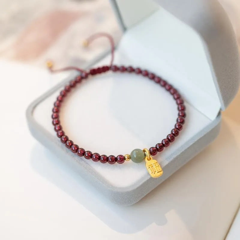 Red rope bracelet with strawberry quartz crystal and hand-woven construction for women