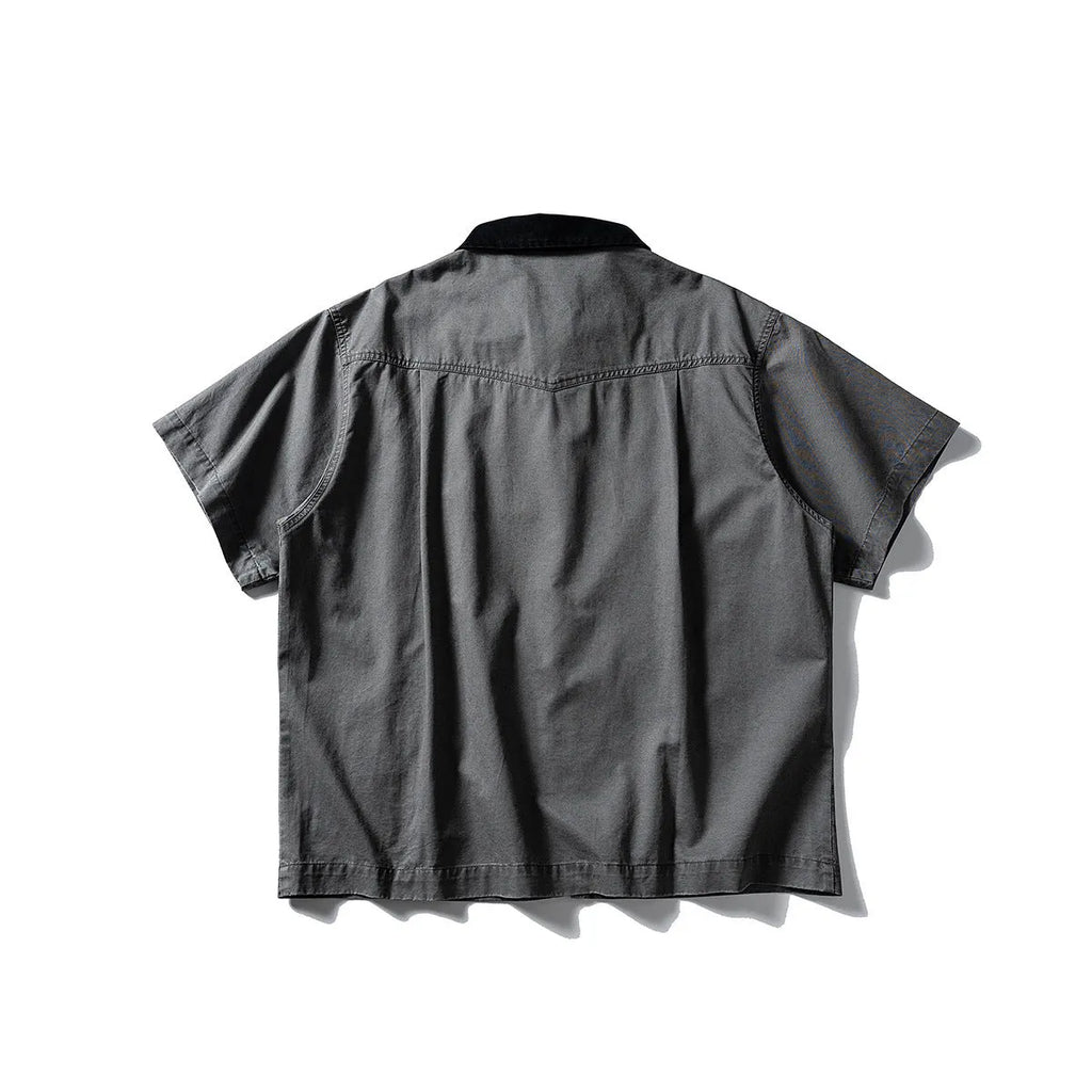 Khaki and grey washed cotton short-sleeved overalls shirt with a loose cardigan fit.