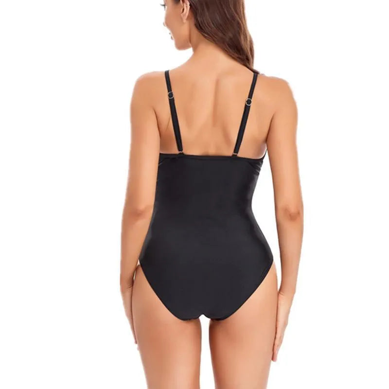 Women's black backless one-piece swimsuit with mesh panel detail.