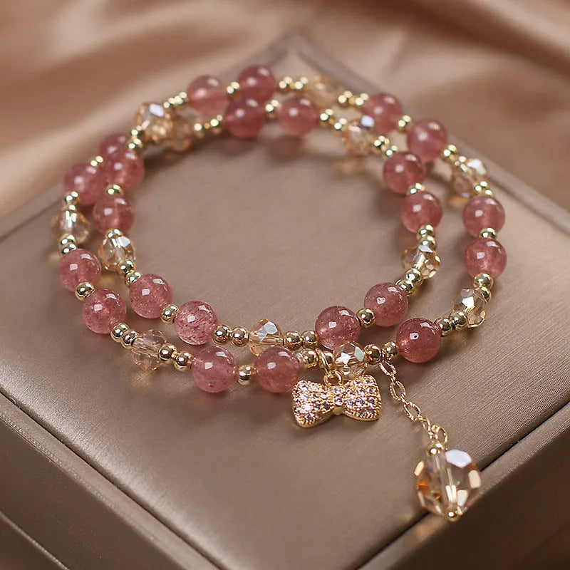 Women's double layer crystal bracelet with lucky cat charm and red cat's eye flowers design.