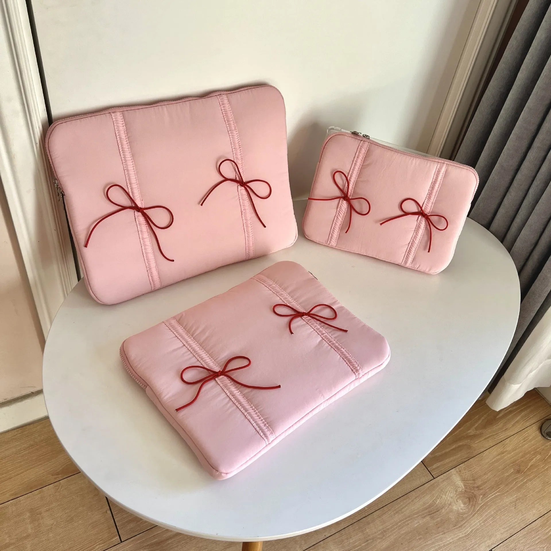 Polyester tablet PC bag with elastic lace bow closure in pink, size 13-14 inches