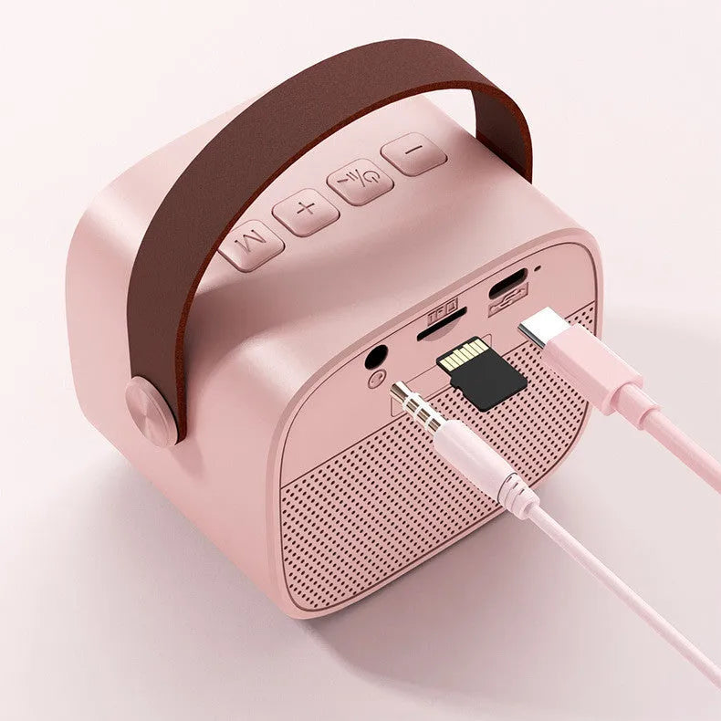 Compact blue, pink, or white wireless Bluetooth speaker with microphone and USB port.