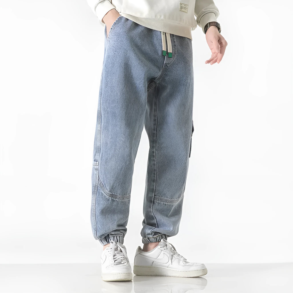 Men's loose-fit tapered trousers in black, available in sizes M through 8XL