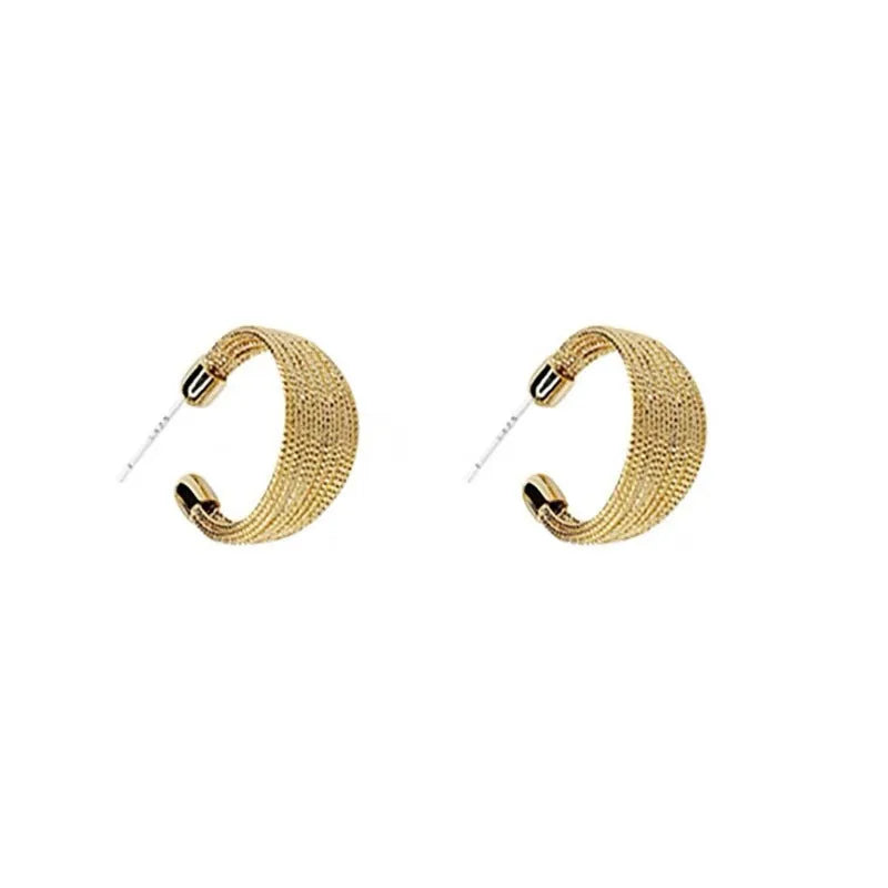 A pair of multi-layer geometric earrings in gold or silver electroplated finish, available as studs or clips.