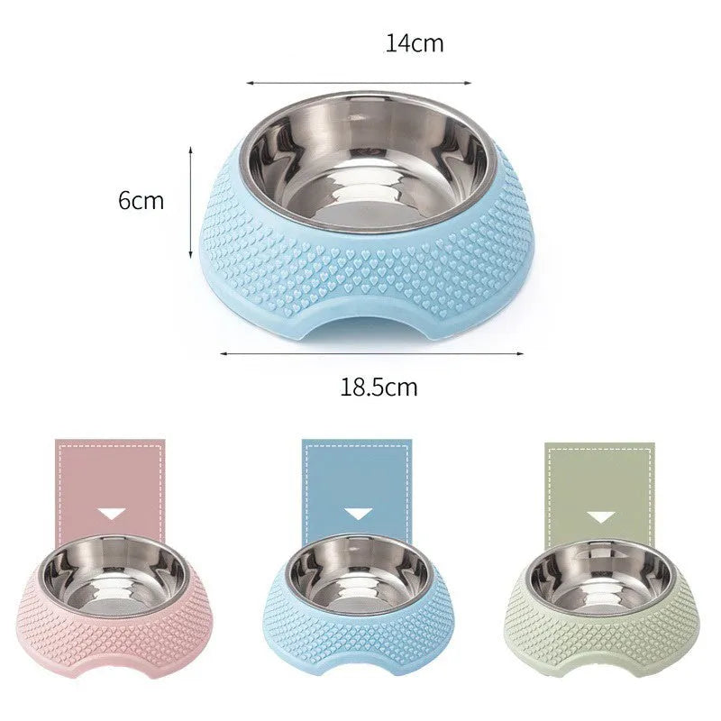 Blue stainless steel pet bowl with non-slip base for cats and dogs on a kitchen floor.