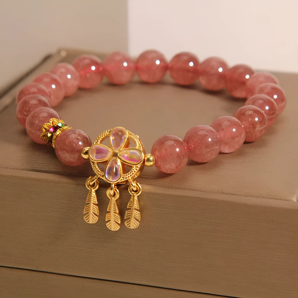 Women's strawberry quartz bracelet with four-leaf clover dream catcher and ball charm pendant