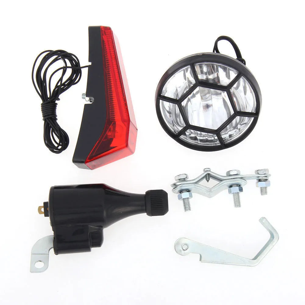 Silver bicycle dynamo-powered generator light set for front and rear bike lighting.