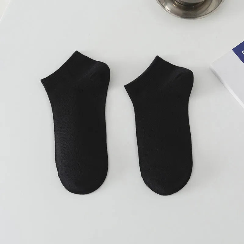 Solid colour low-cut polyester boat socks for men, shown in one of six available colours.