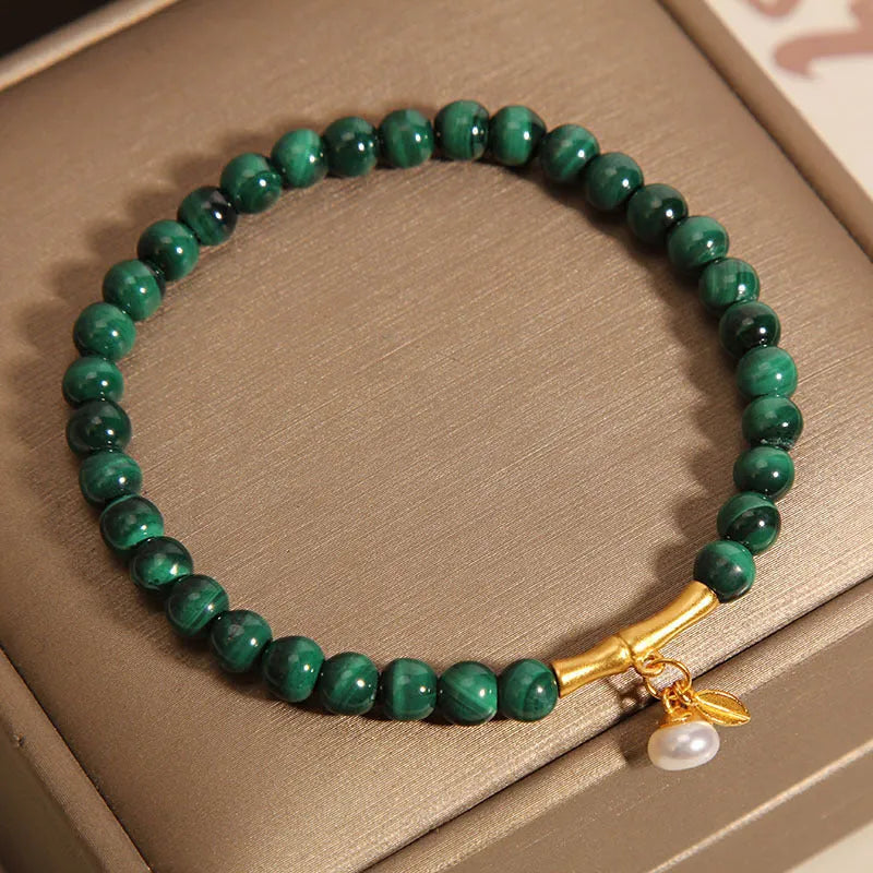 Women's adjustable lucky bamboo bracelet with white crystal detailing on wrist