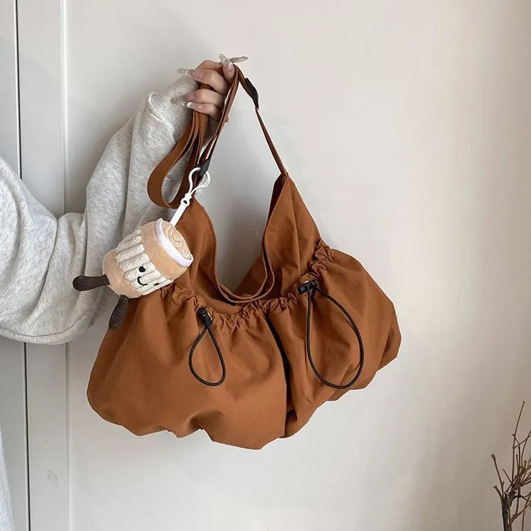 Ultra-light pleated crossbody student cloth bag in beige with split pocket and strap
