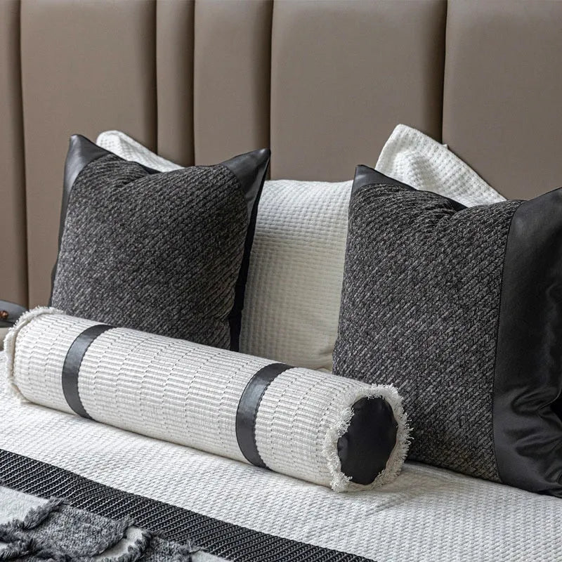Grey and white plaid bed runner blanket with matching pillow on a 1.5m bed in a minimalist bedroom setting.