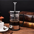 Compact stainless steel and glass drip coffee maker with 350ml capacity.