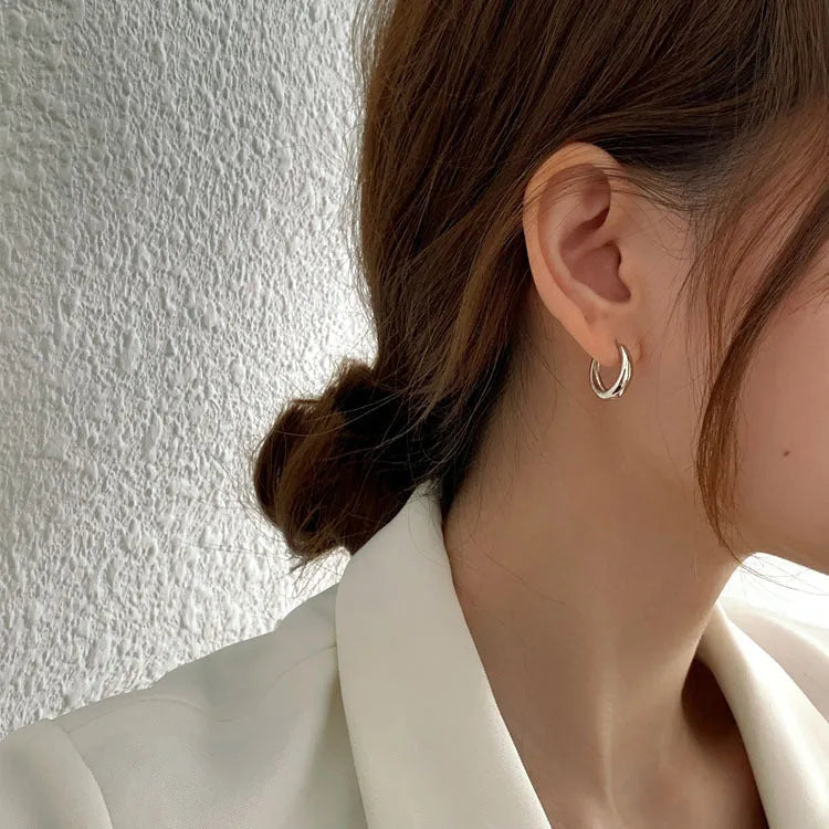 Women's minimalist copper water drop earrings in gold and silver, shown in large, medium, and small sizes.