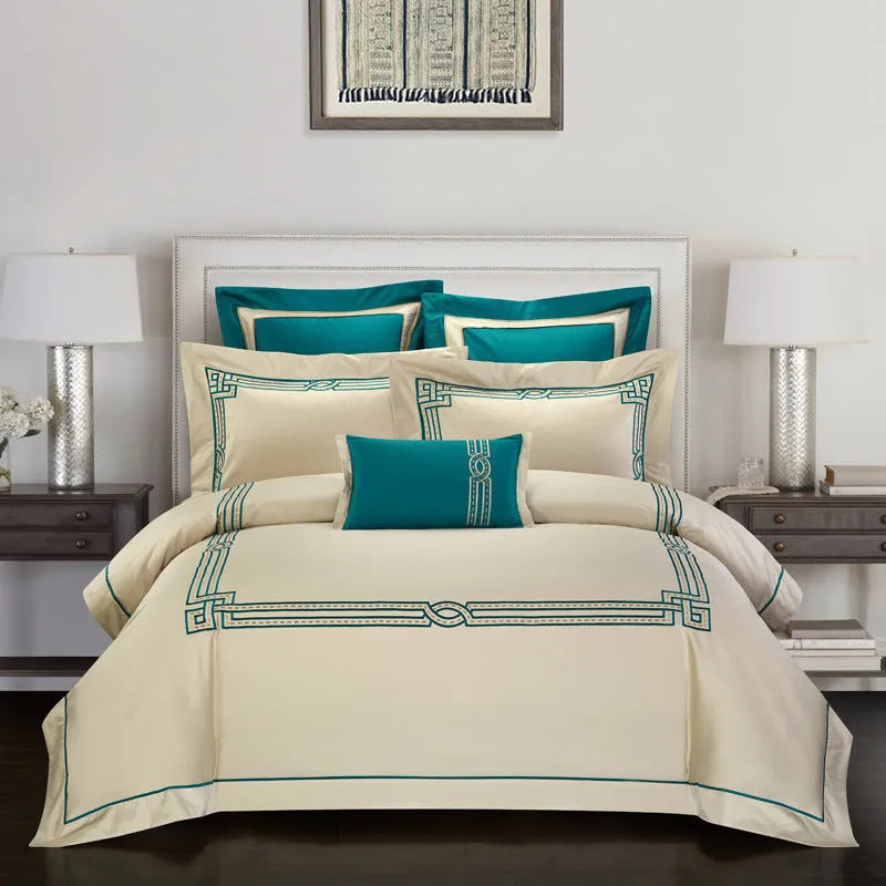 Four-piece cotton embroidery bedding set with detailed embroidery pattern on satin weave fabric