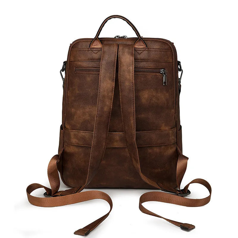Retro college backpack with curved shoulder straps in six colour options including black, blue, and yellow apricot
