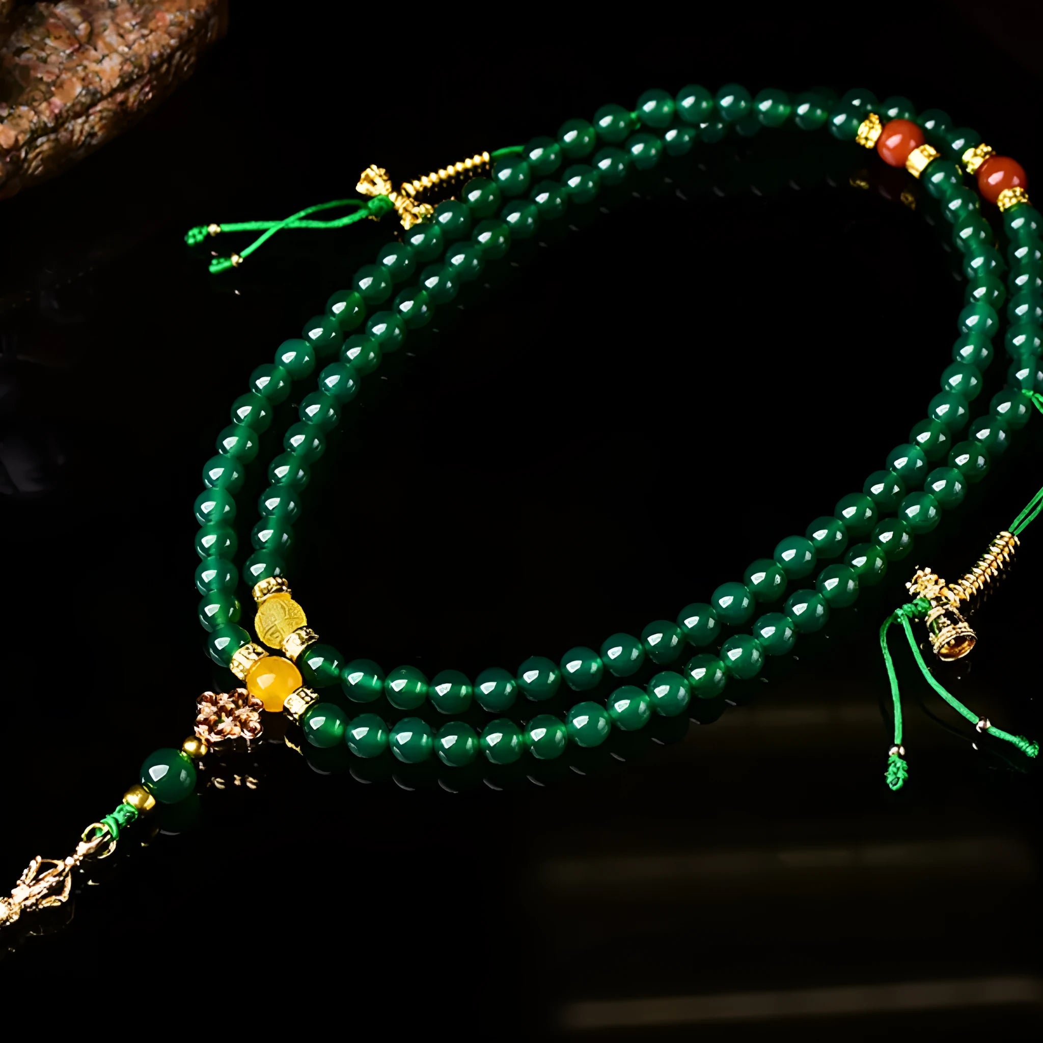 Brazilian green agate multi-strand bracelet showing different bead sizes on a wrist.