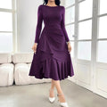 Purple women's dress with ruffle detailing, long sleeves, and round neck in mid waist design