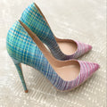 Pink to blue gradient patent leather ladies pointed toe high heels on a plain background