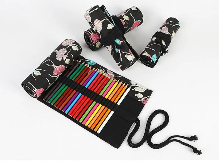 Square canvas rolling pencil case with ballet girl print, unrolled to show multiple pencil holes.