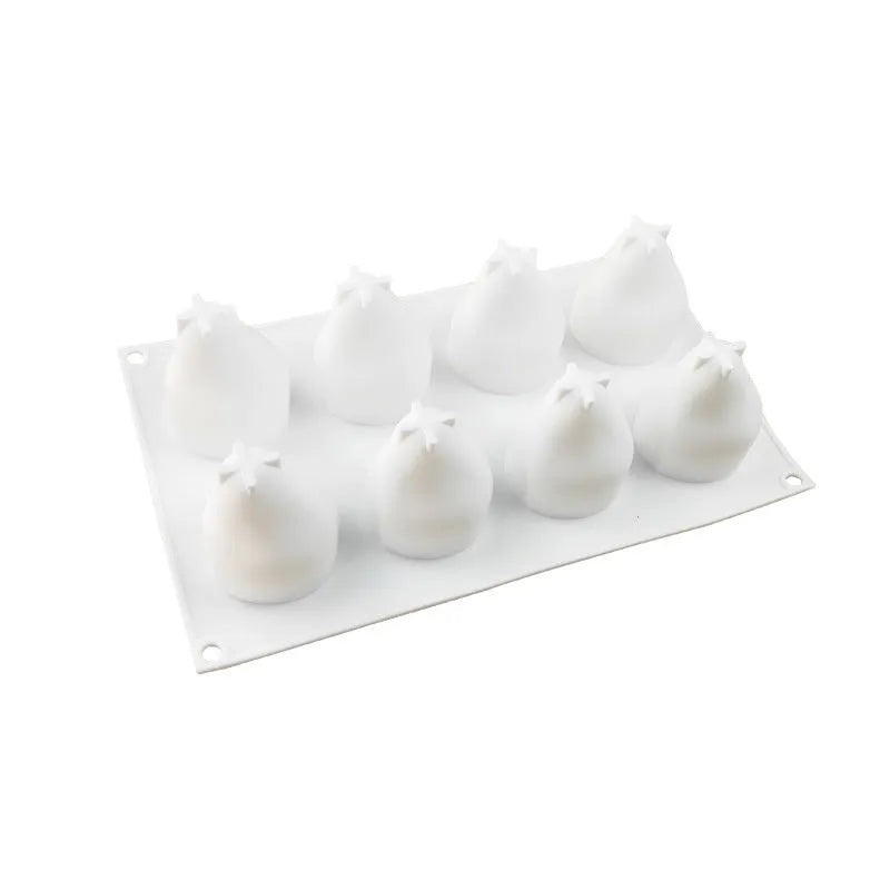 Set of six silicone fruit baking moulds showing pineapple and pine cone shapes