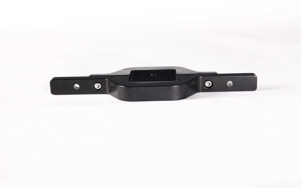 Black metal general coupler bracket for mounting a trailer hook lamp holder on a vehicle.