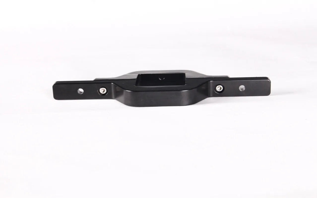 Black metal general coupler bracket for mounting a trailer hook lamp holder on a vehicle.