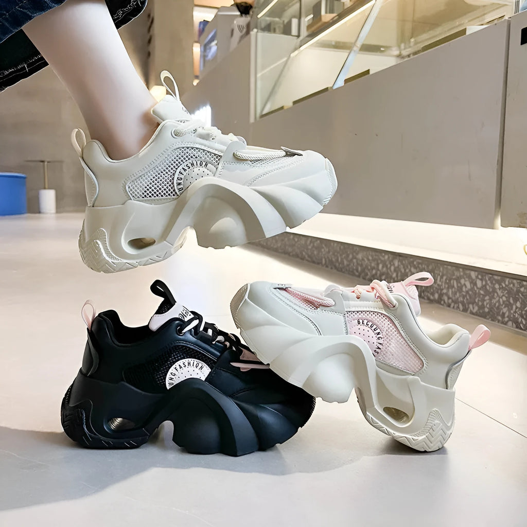 Women's pink casual sneakers with thick sole and cross-shoulder straps on a white background