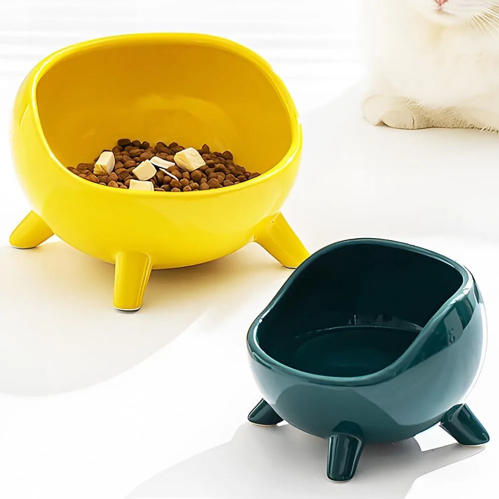 Green ceramic pet food bowl with four stabilising legs and wide opening