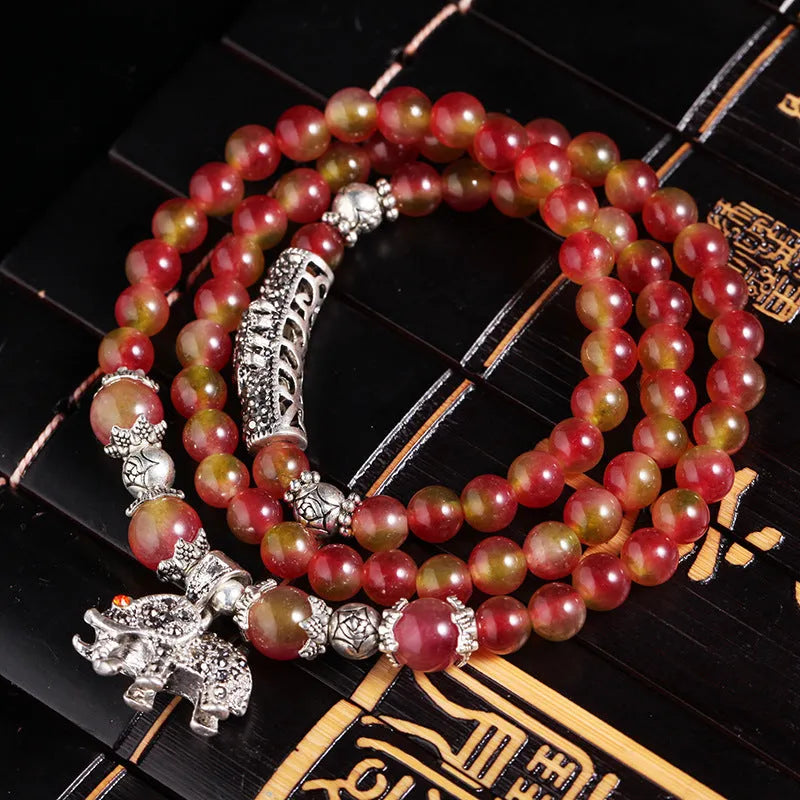 Handmade Chinese knot bracelet with natural watermelon crystal beads in traditional design