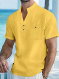 Men's light blue linen stand collar short sleeve t-shirt shown on a model, loose fit.