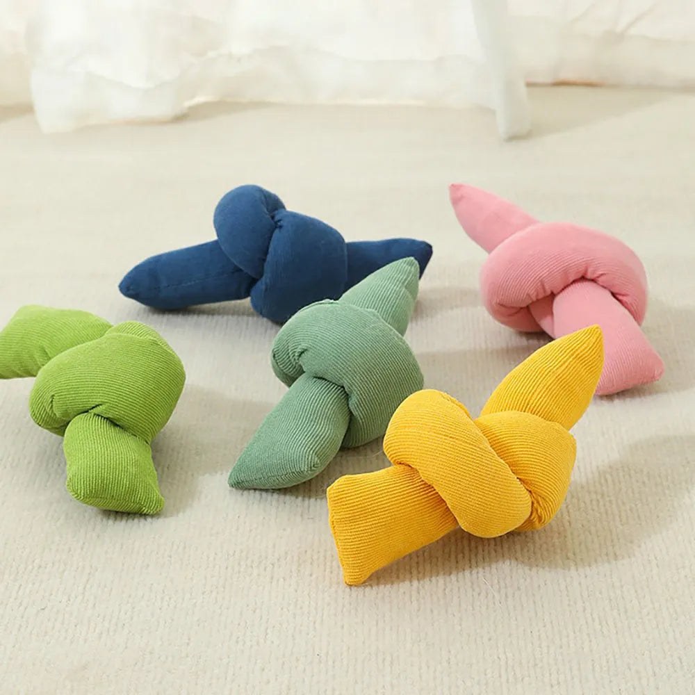 White cotton dog rope toy with multiple sturdy knots for tugging and chewing