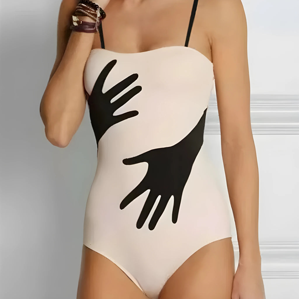 Women's one-piece bikini swimsuit with a gauze skirt attached, shown on a model.