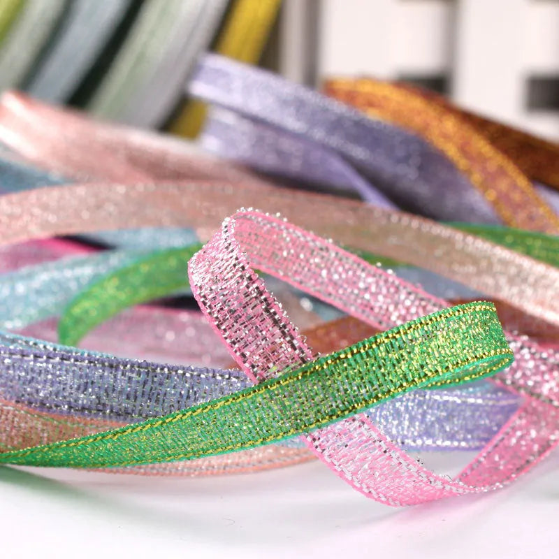 Roll of 0.6cm wide polyester gift ribbon in multiple colour options including gold leaf and red onion.