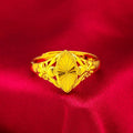 Geometric gold flower ring with open setting and textured details on brass base