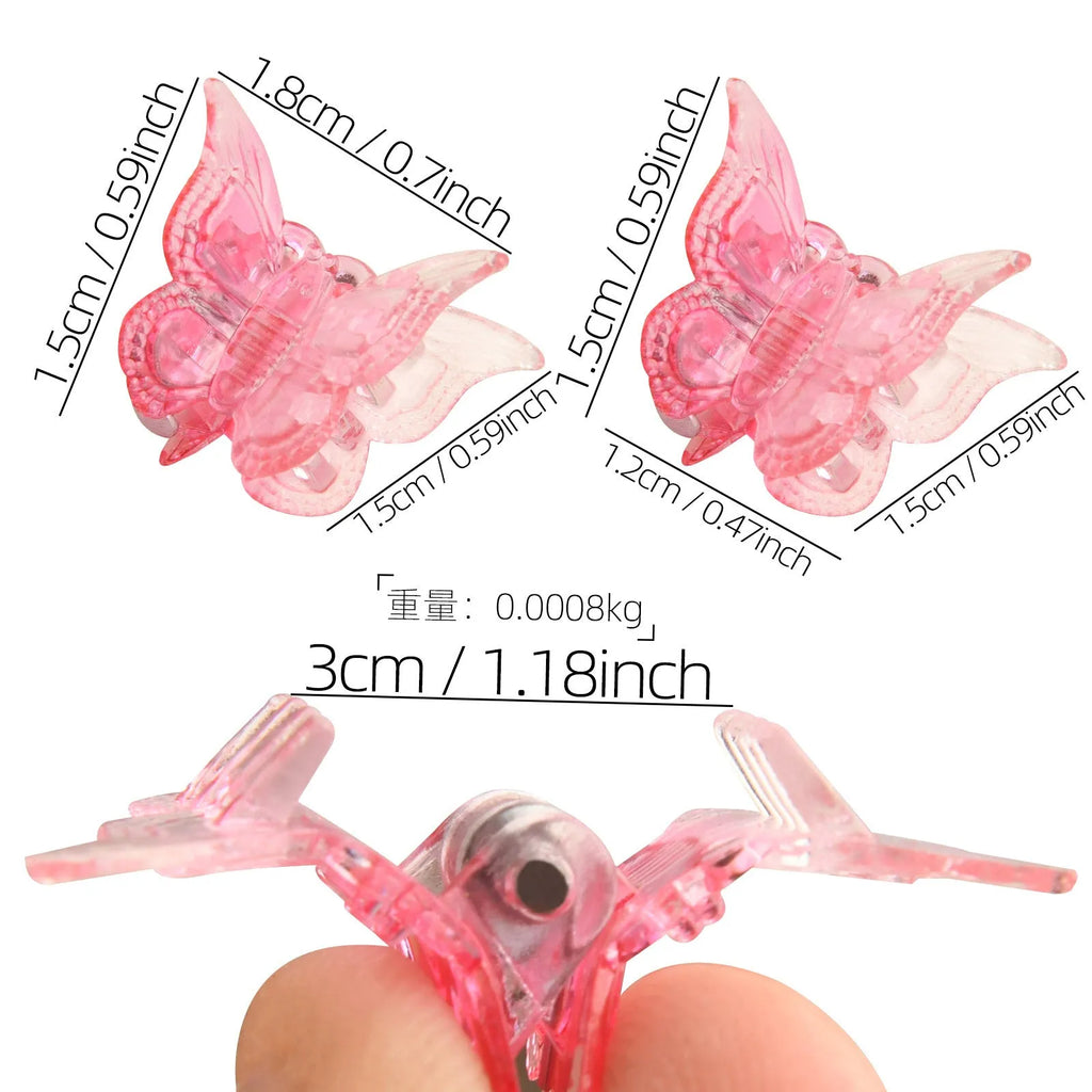 Set of 50 glitter mini butterfly-shaped hair claw clips in assorted colours on a white background.