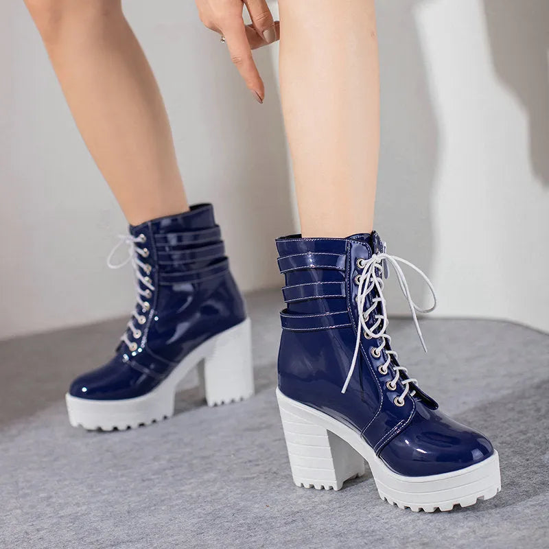 Women's black thick-heel short boots with front lace-up and round toe on a waterproof rubber sole.