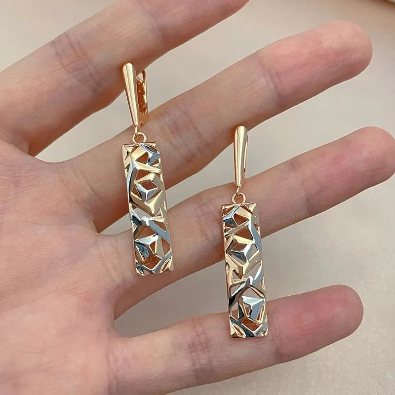 Rectangular hollow stud earrings with a two-tone picture style finish.